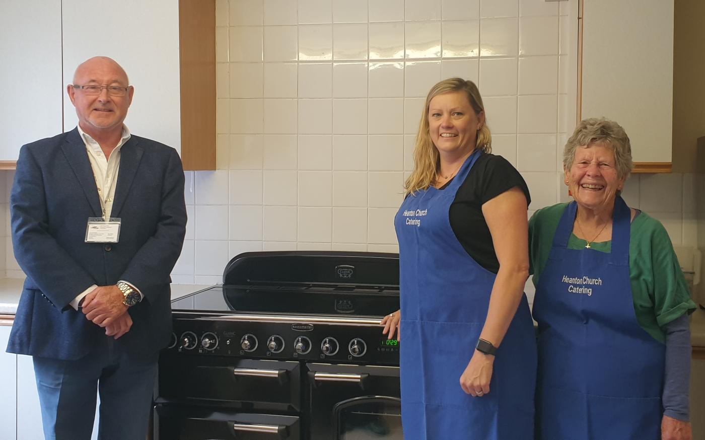 Ross Moon with the ladies of the Heanton Lunch Club and their new Rangemaster cooker