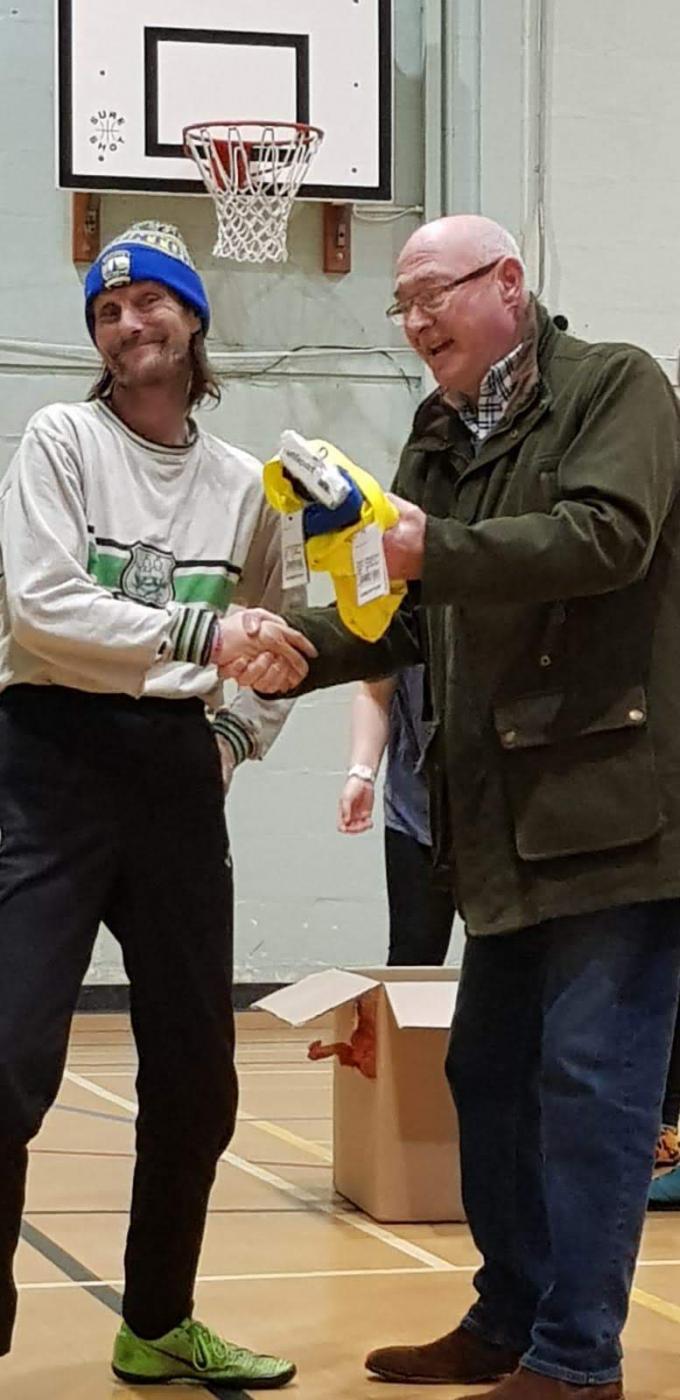 Ross Moon presenting hoodies to Braunton Football Ability Club