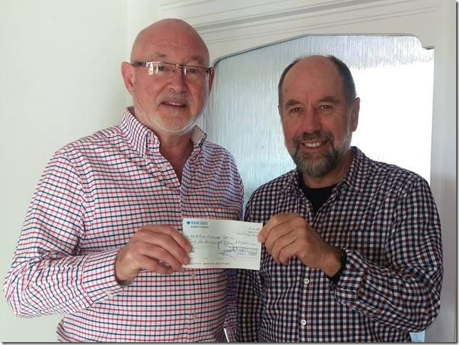 Ross Moon presenting a cheque for £25,000 to Ken Rutherford of the Braunton Countryside Centre