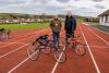 Ben Byrom and Ross Moon presenting cycles to North Devon Athletics Club & GRIPPhysiotherapy
