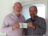 Ross Moon presenting a cheque for £25,000 to Ken Rutherford of the Braunton Countryside Centre