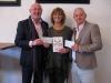 Mike Leverton President of Rotary Club of Braunton and Ross Moon presenting cheques to Trish Parsons for the Braunton Sports Directory